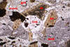 Hexagonal cordierite pseudomorphs in thin section
   DLB9b. Field of view [4 mm] shows the relationship between one
   of these
   pseudomorphs and the matrix and other minerals in the rock