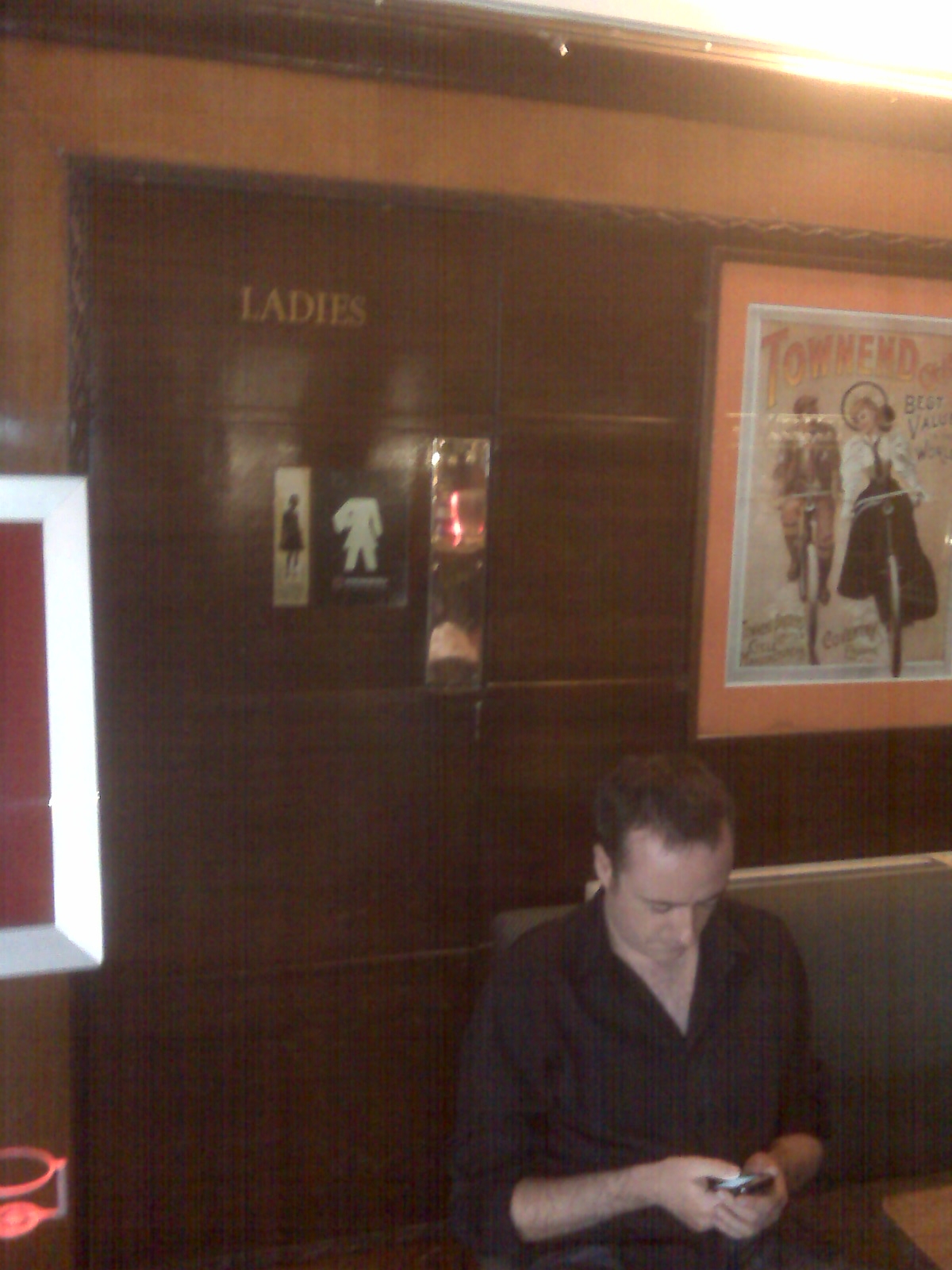 Andy W in front of the secret door to the ladies' at the Windermere, South Kenton