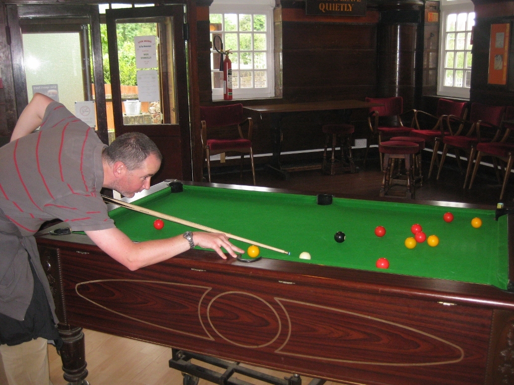 Mark Giles playing pool at the Windermere, South Kenton