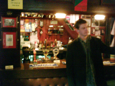 Smiley in the Nelson, pointing the wrong way at bar snacks